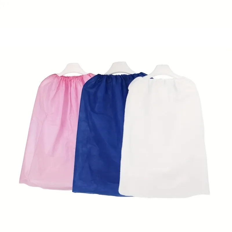 Pink, blue and white disposable non-woven bathrobes on hangers for spa and salon wholesale