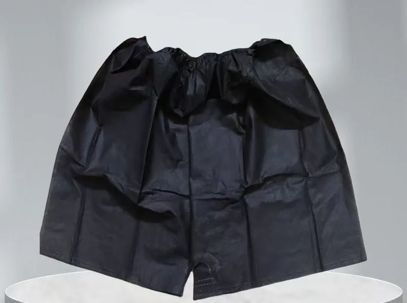 Black disposable non-woven boxer shorts on display stand for spa and beauty salon wholesale